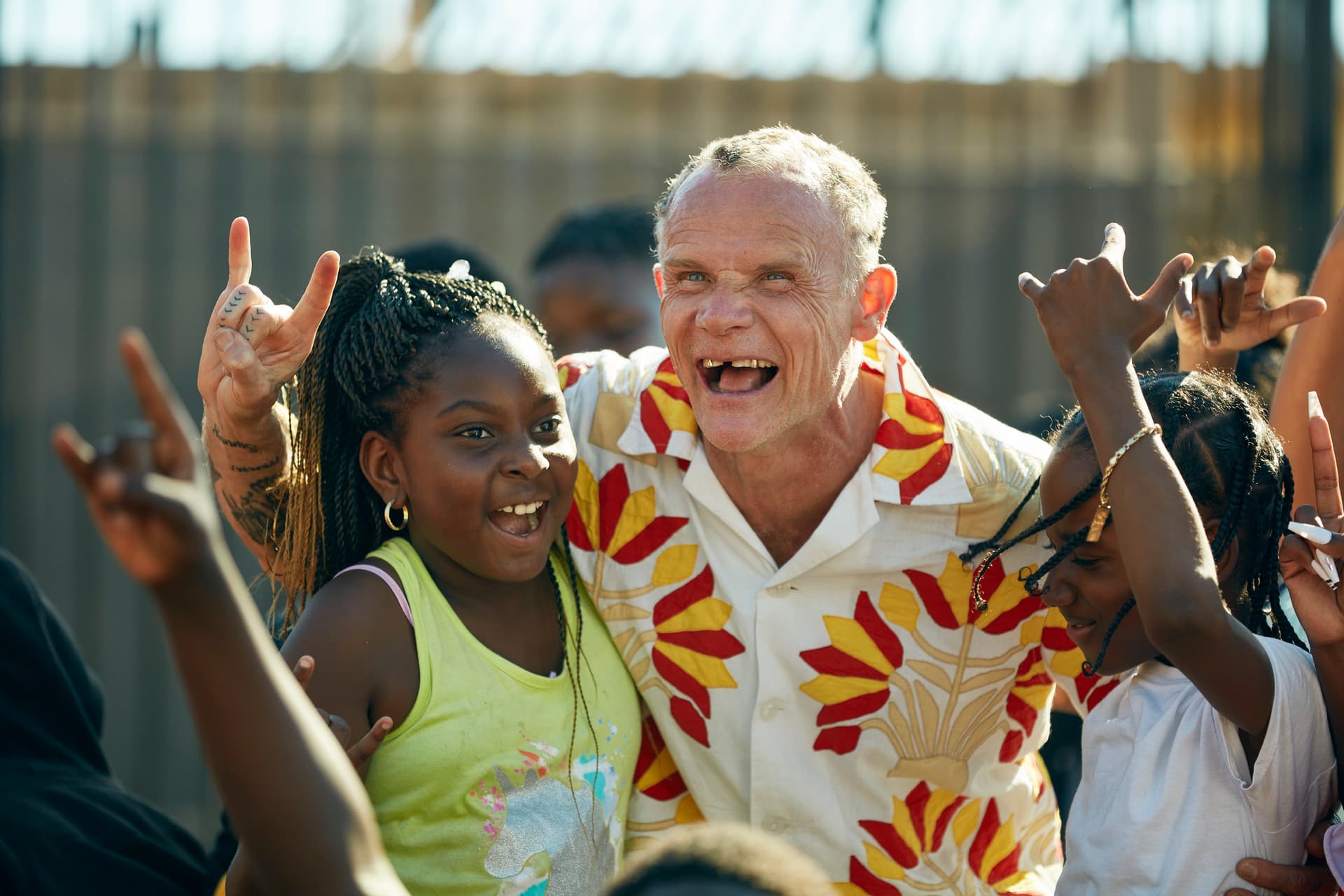 Flea, of the Red Hot Chilli Peppers, with kids from Nickerson Playground in Watts, Los Angeles designed by NBBJ | ESI Design.